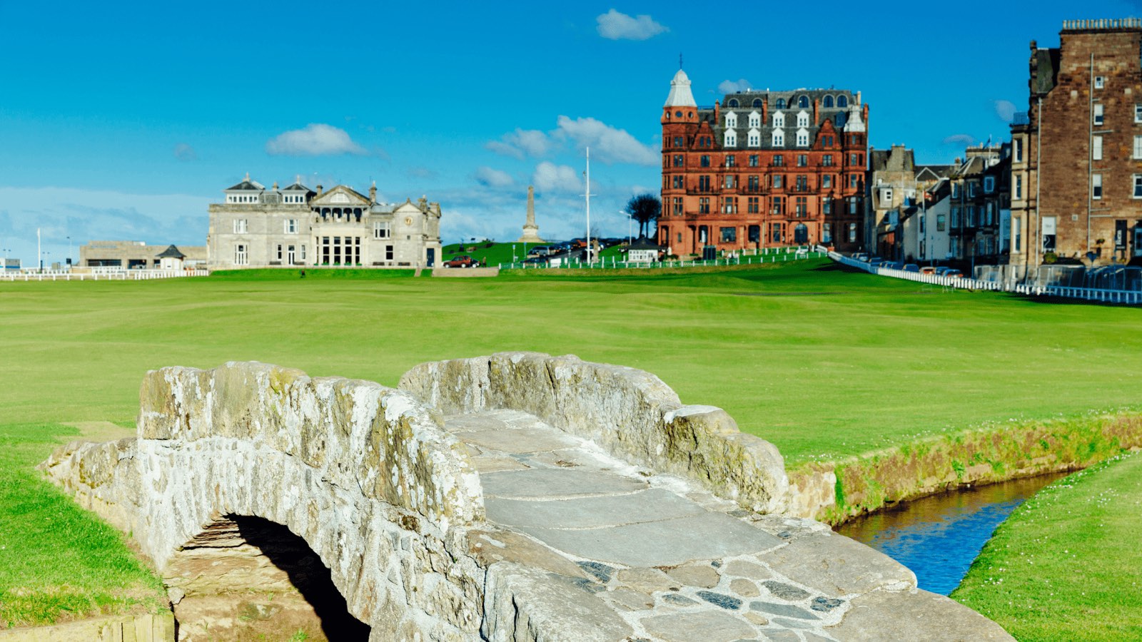 The Swilcan Bridge and clubhouse on the Old Course at St Andrews, Scotland