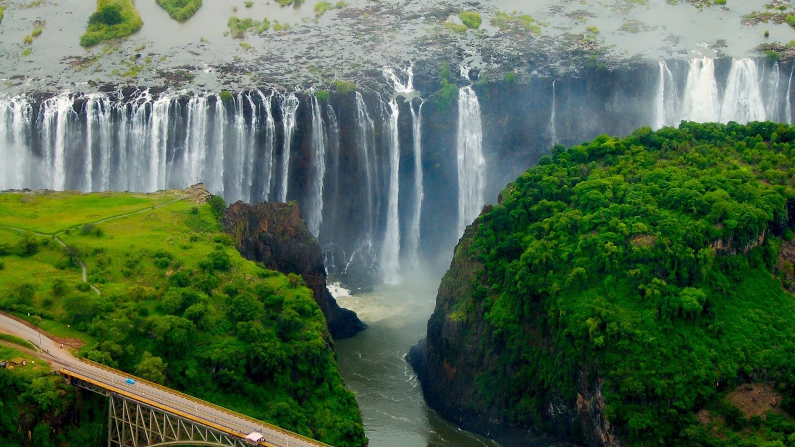 Victoria Falls and its gorge seen from the air, with the bridge below